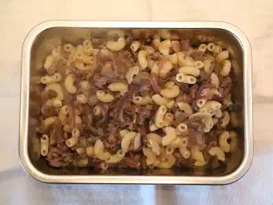 Hühnerherzen mit Hörnchen und Zwiebeln Rezeptbild zu Hühnerherzen mit Hörnchen und Zwiebeln